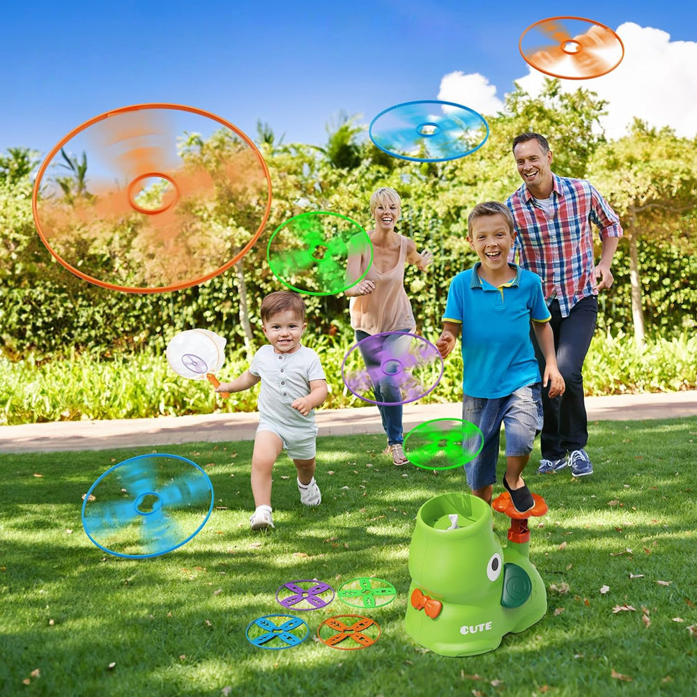 Family playing with the disc launcher in the garden