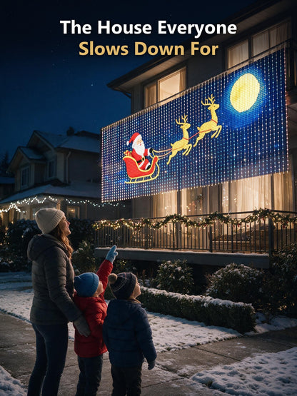Kids pointing at the Santa sleigh balcony display